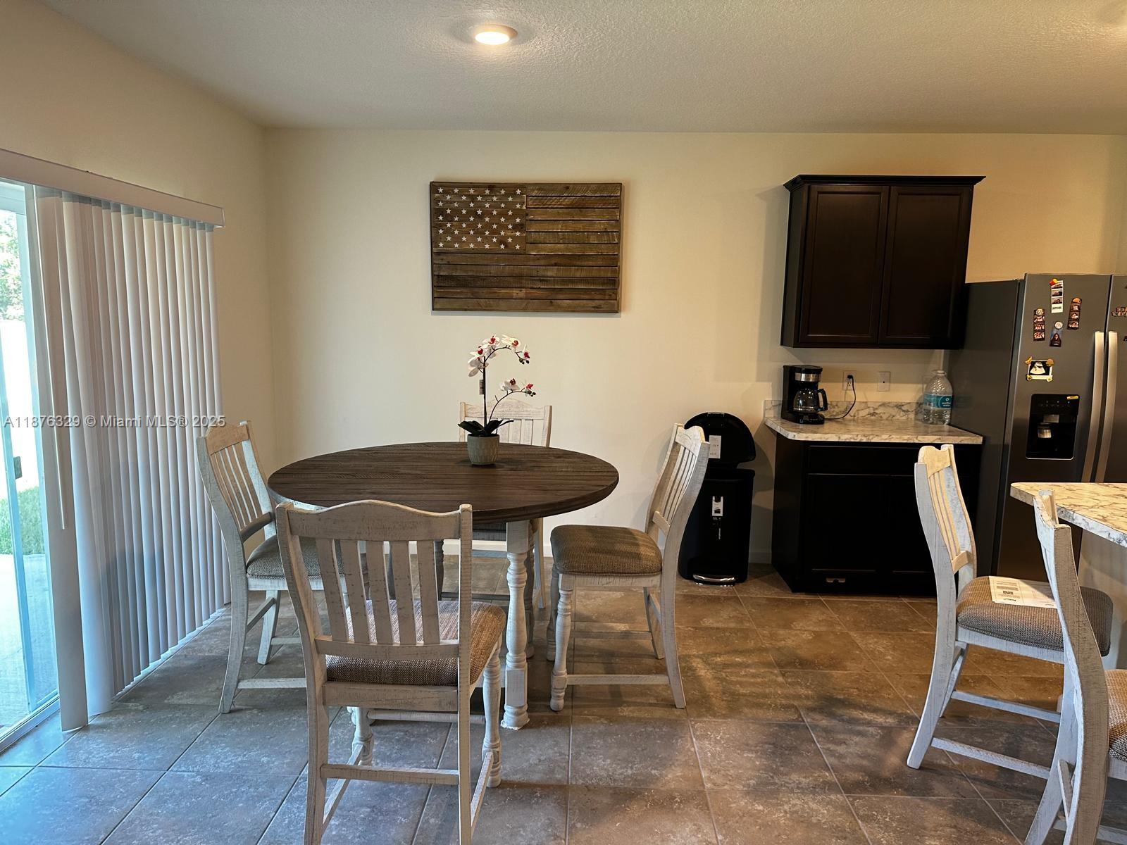 2098 Southwest Altman Avenue Port St. Lucie, FL 34953 - Photo 10 of 27 a table and chairs in a room