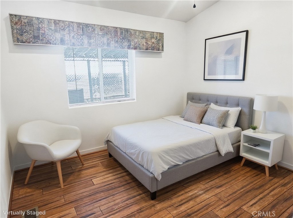 18070 Langlois Road Desert Hot Springs, CA 92241 - Photo 14 of 14 a bedroom with a bed and a chair
