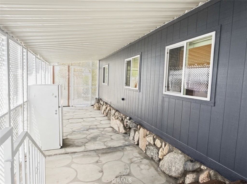 18070 Langlois Road Desert Hot Springs, CA 92241 - Photo 2 of 14 a view of an entryway with wooden floor
