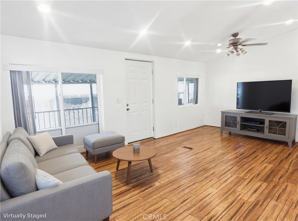 18070 Langlois Road Desert Hot Springs, CA 92241 - Photo 6 of 14 a bedroom with furniture and a flat screen tv