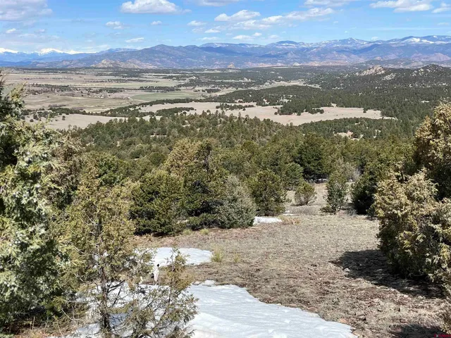 a view of an outdoor space with mountain view in back