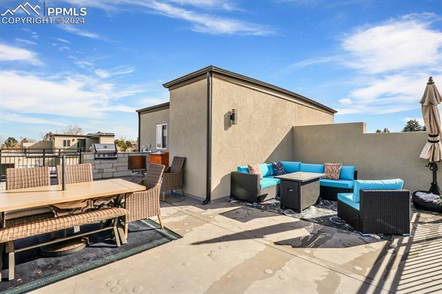 74 Sommerlyn Road Colorado Springs, CO 80906 - Photo 30 of 32 View of patio / terrace featuring a grill and an outdoor living space