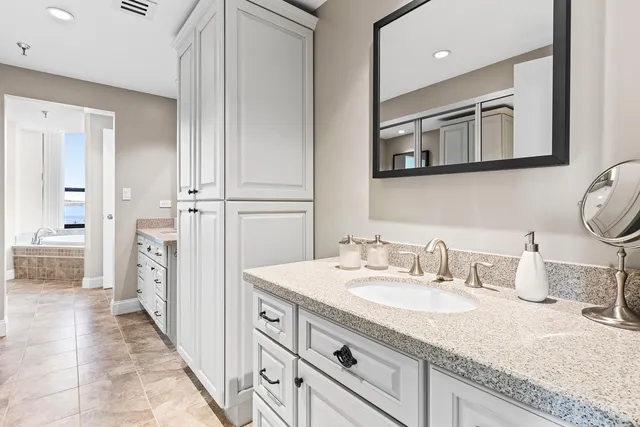 a bathroom with a bathtub and shower