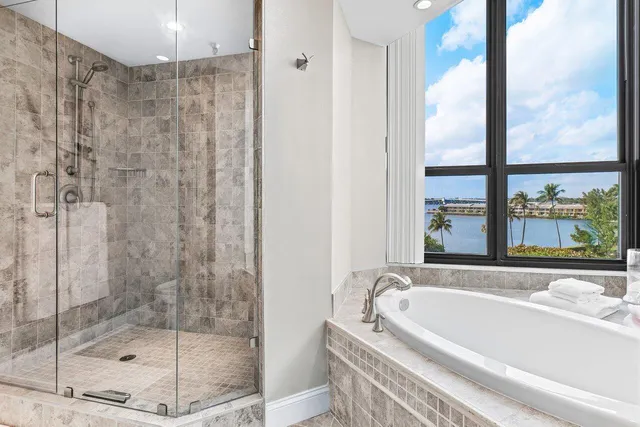 a bath tub sitting next to a window