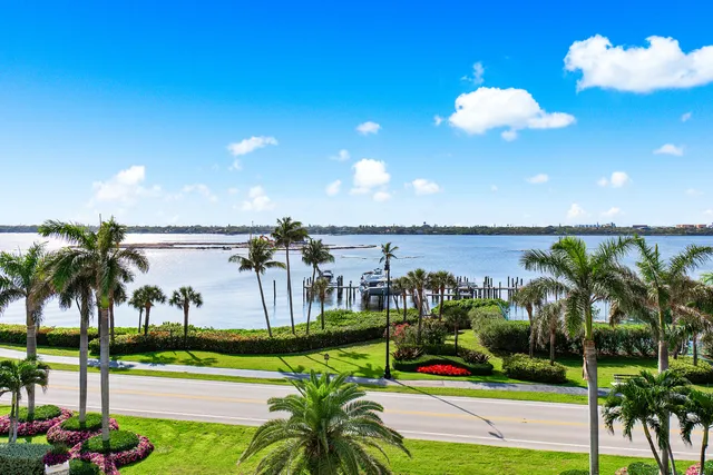 a front view of a building with a garden