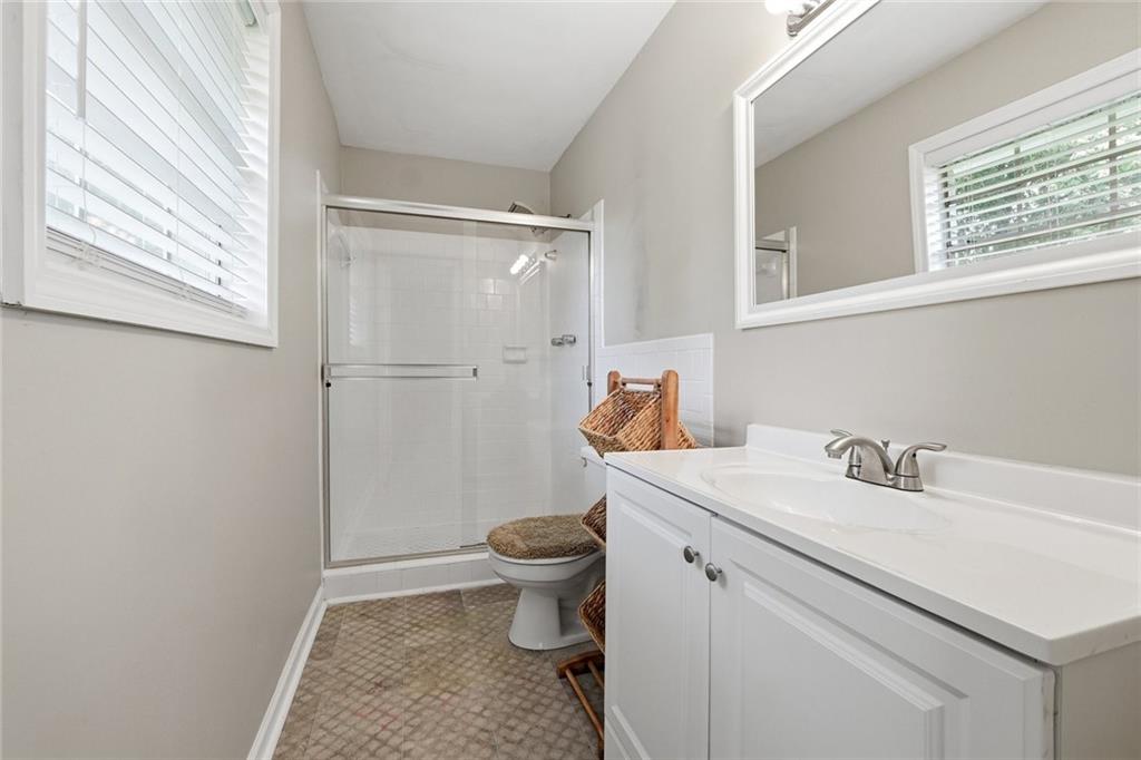 1619 Ridgeview Drive Northwest Conyers, GA 30012 - Photo 17 of 20 a bathroom with a sink toilet and shower