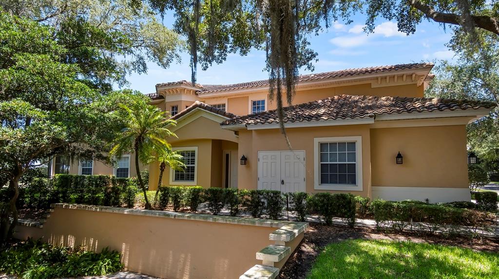 23 Camino Real, Unit 23 Howey-in-the-Hills, FL 34737 - Photo 6 of 46 a front view of a house with garden