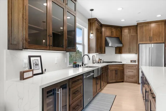 a kitchen with a sink stove and refrigerator