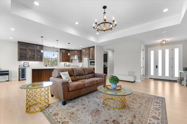 a living room with furniture and a dining table