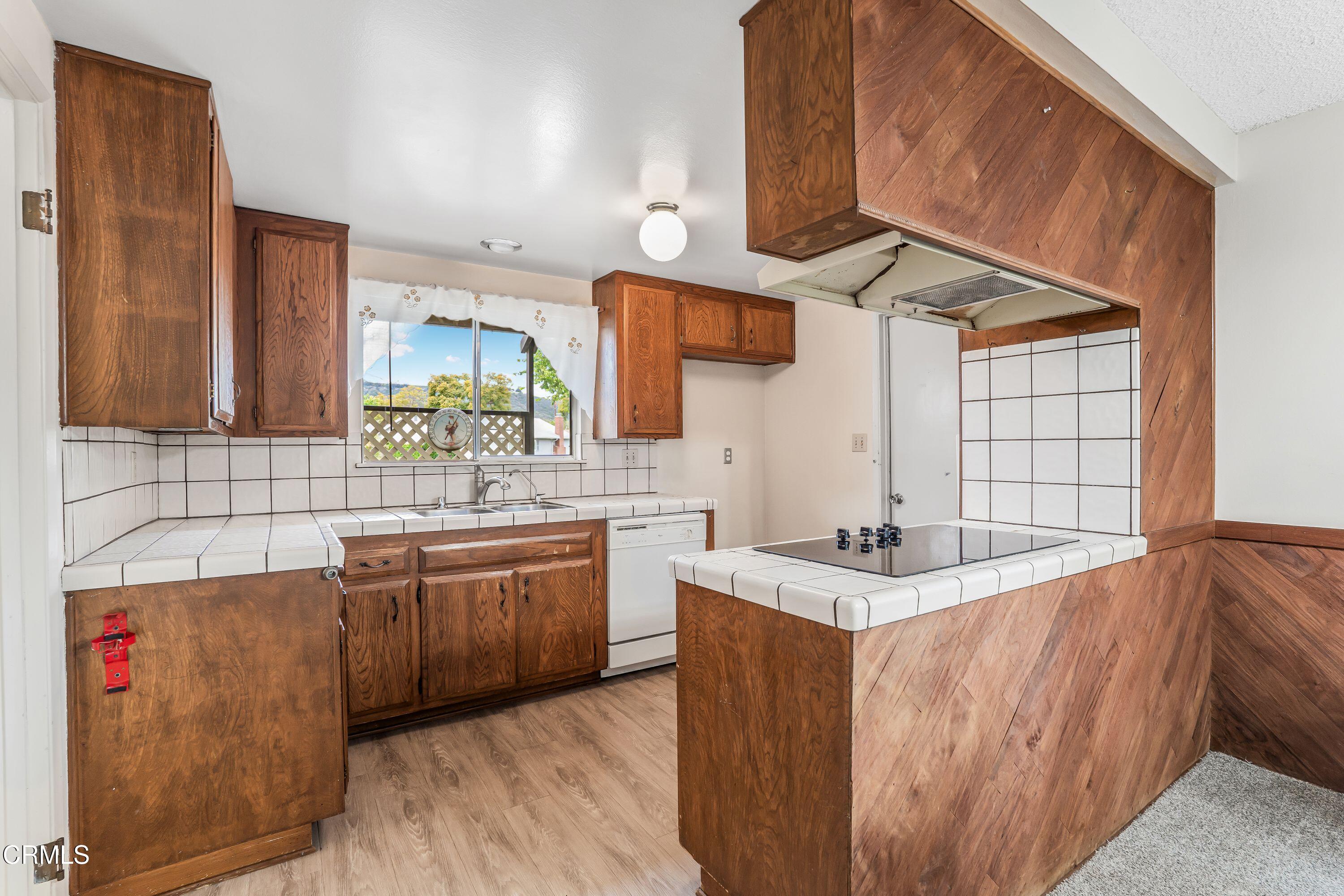 1738 Abbott Avenue Camarillo, CA 93010 - Photo 11 of 36 a kitchen with stainless steel appliances granite countertop a sink and a stove