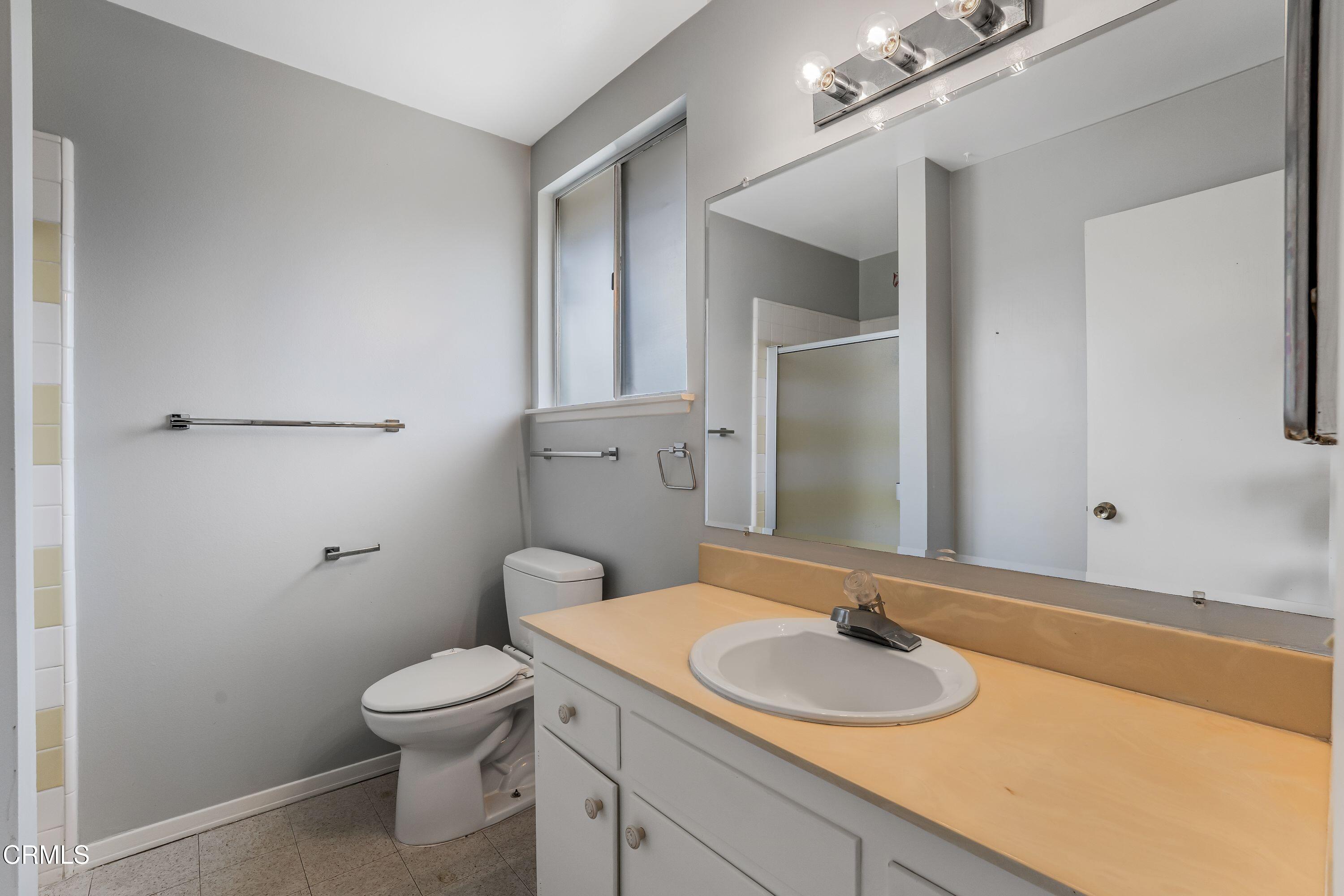 1738 Abbott Avenue Camarillo, CA 93010 - Photo 16 of 36 a bathroom with a granite countertop sink toilet and mirror
