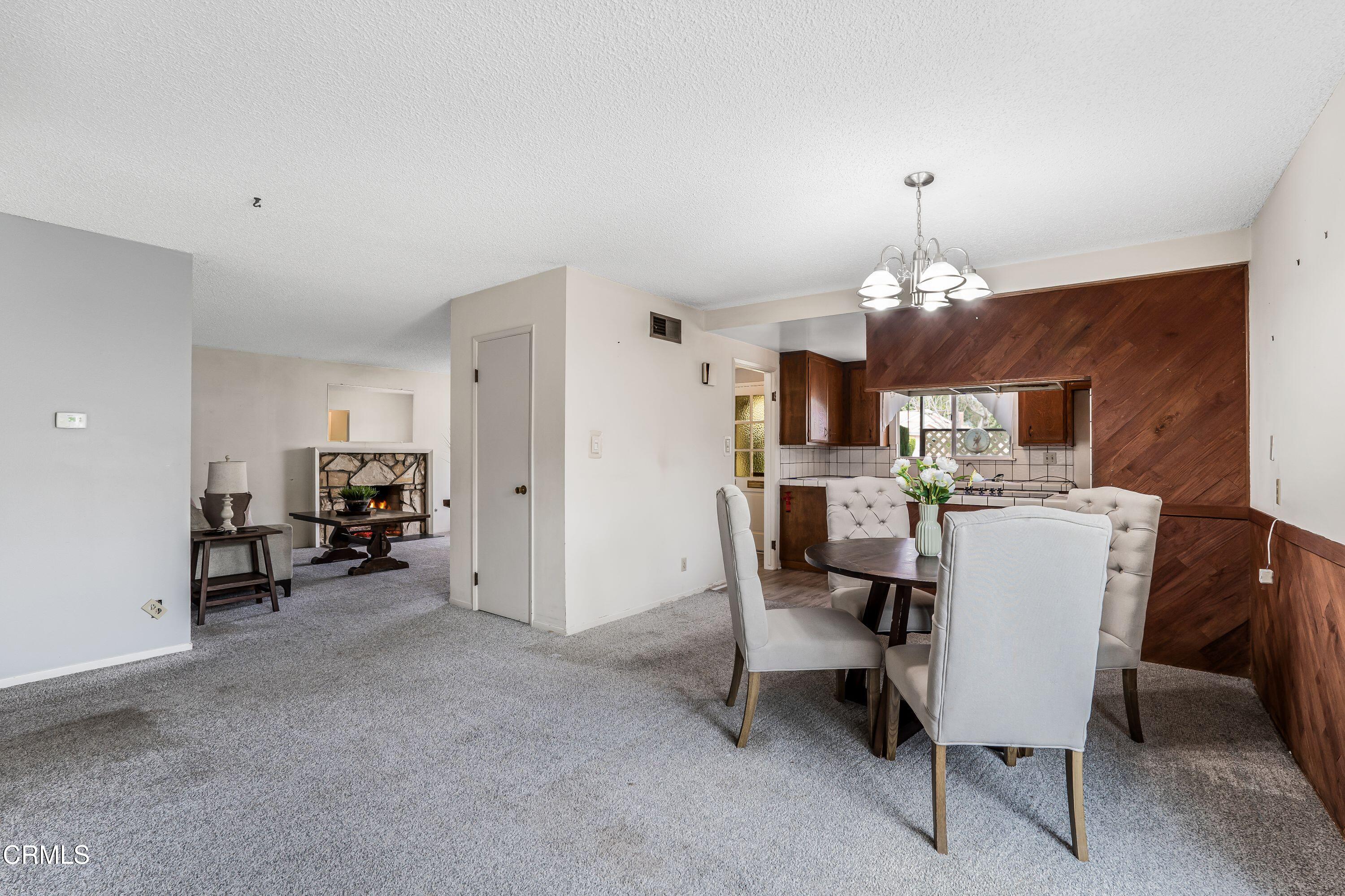 1738 Abbott Avenue Camarillo, CA 93010 - Photo 10 of 36 a view of a dining room with furniture and a chandelier