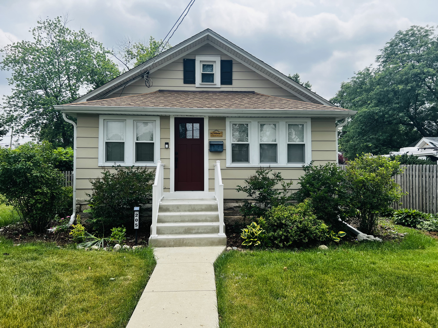 205 West Harrison Road Lombard, IL 60148 - Photo 1 of 26 a front view of a house with a yard