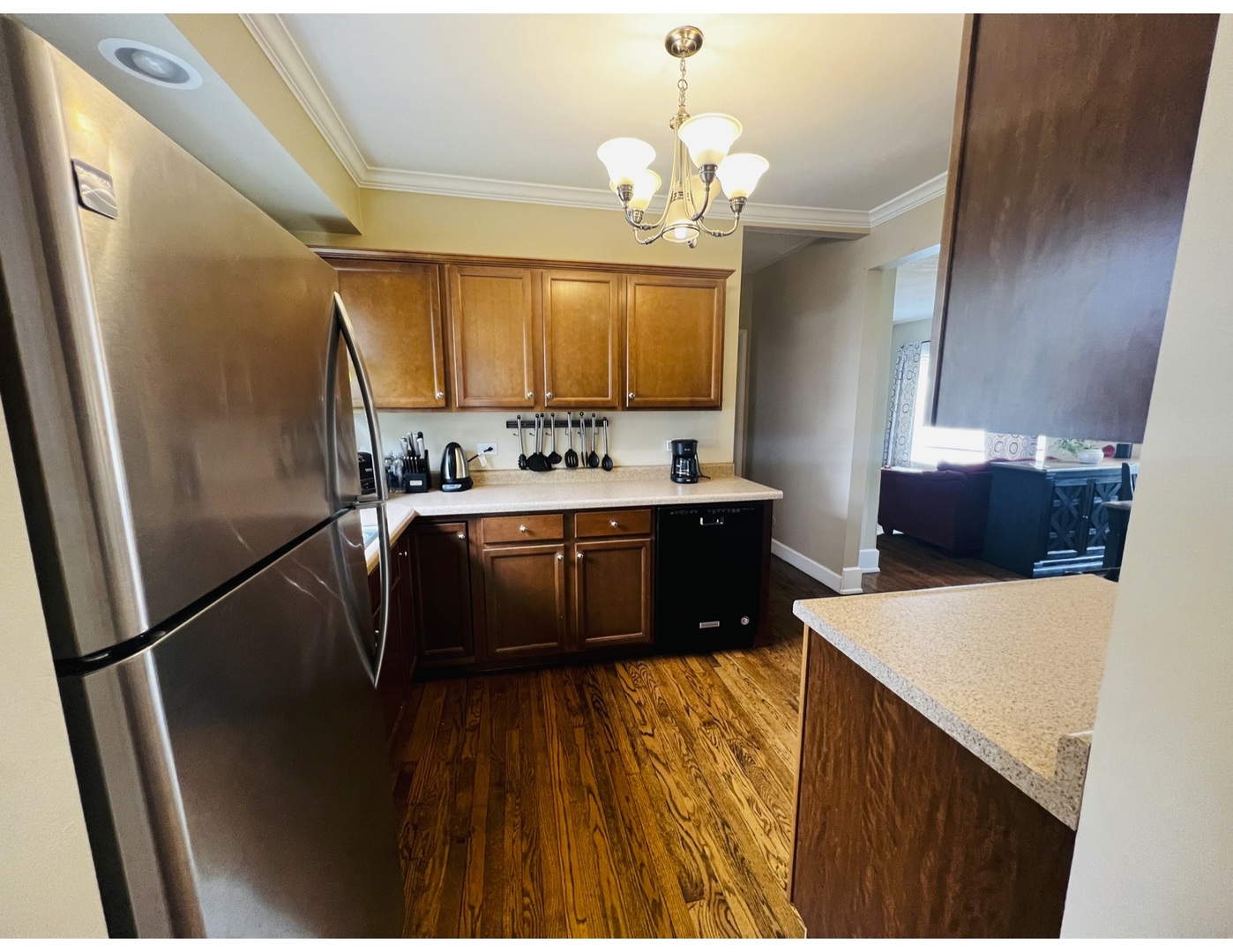 205 West Harrison Road Lombard, IL 60148 - Photo 18 of 26 a kitchen with a sink appliances and cabinets