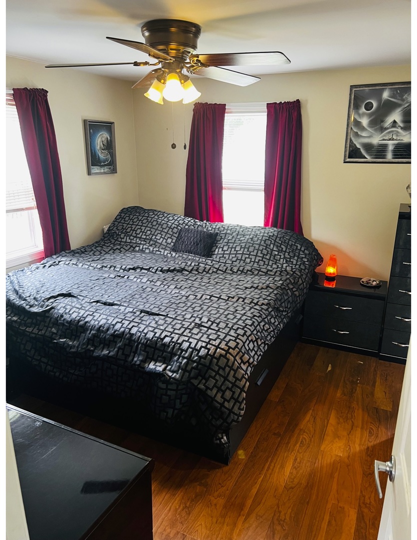 205 West Harrison Road Lombard, IL 60148 - Photo 21 of 26 a bedroom with bed and a window