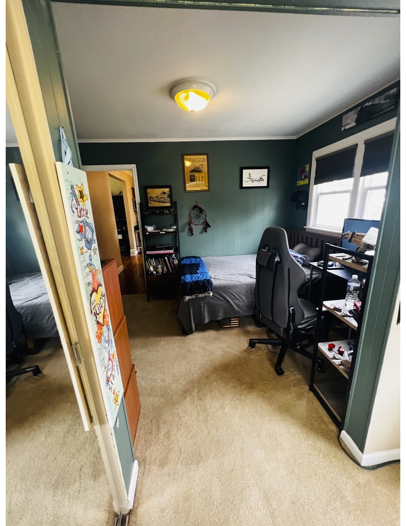 205 West Harrison Road Lombard, IL 60148 - Photo 26 of 26 a room with furniture and a flat screen tv