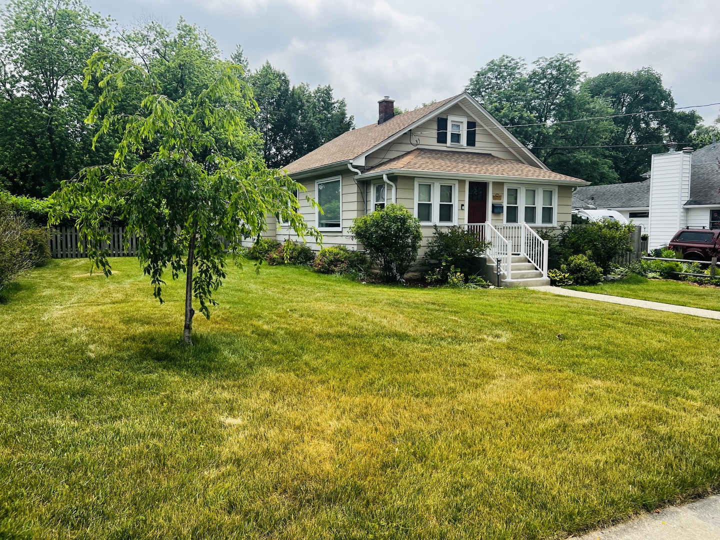 205 West Harrison Road Lombard, IL 60148 - Photo 3 of 26 a front view of a house with a yard