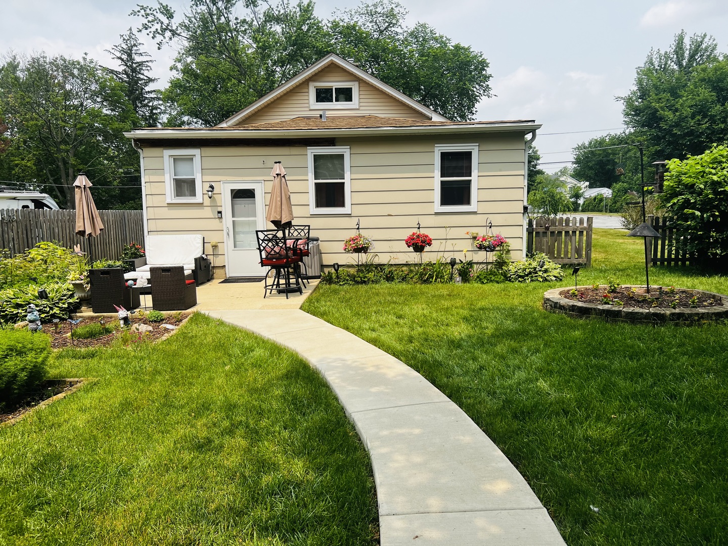 205 West Harrison Road Lombard, IL 60148 - Photo 5 of 26 a front view of house with a garden and patio
