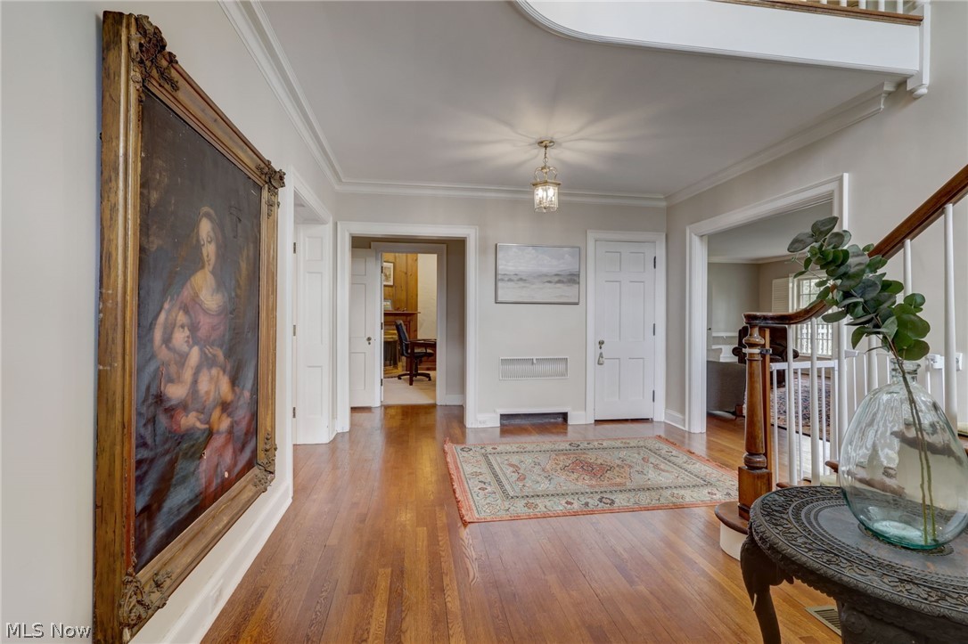 102 Wolcott Road Akron, OH 44313 - Photo 5 of 48 Entrance foyer featuring crown molding and wood flooring