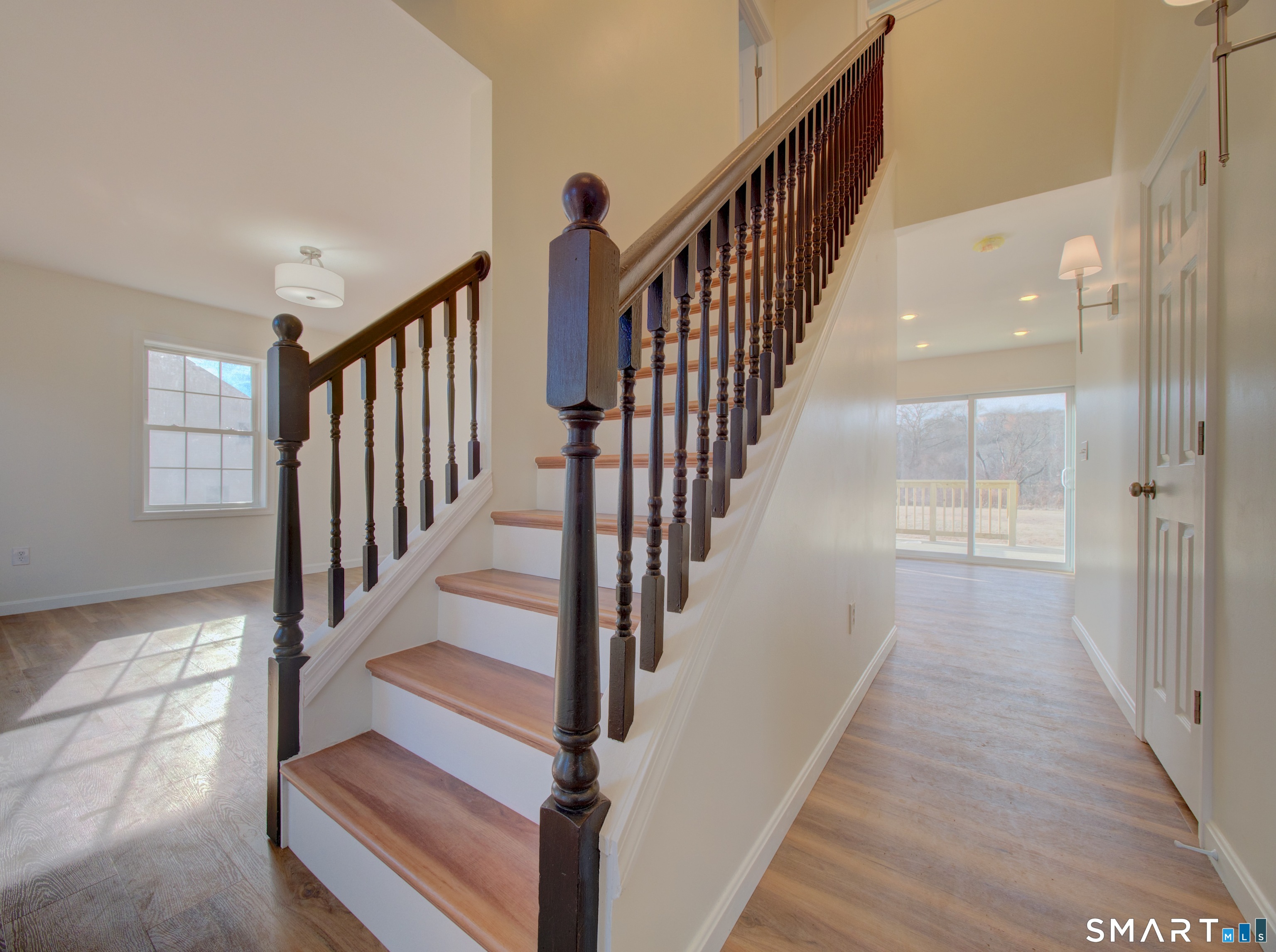 55 Tuckie Road Windham, CT 06280 - Photo 6 of 17 a view of staircase with lots of frames on wall and wooden floor