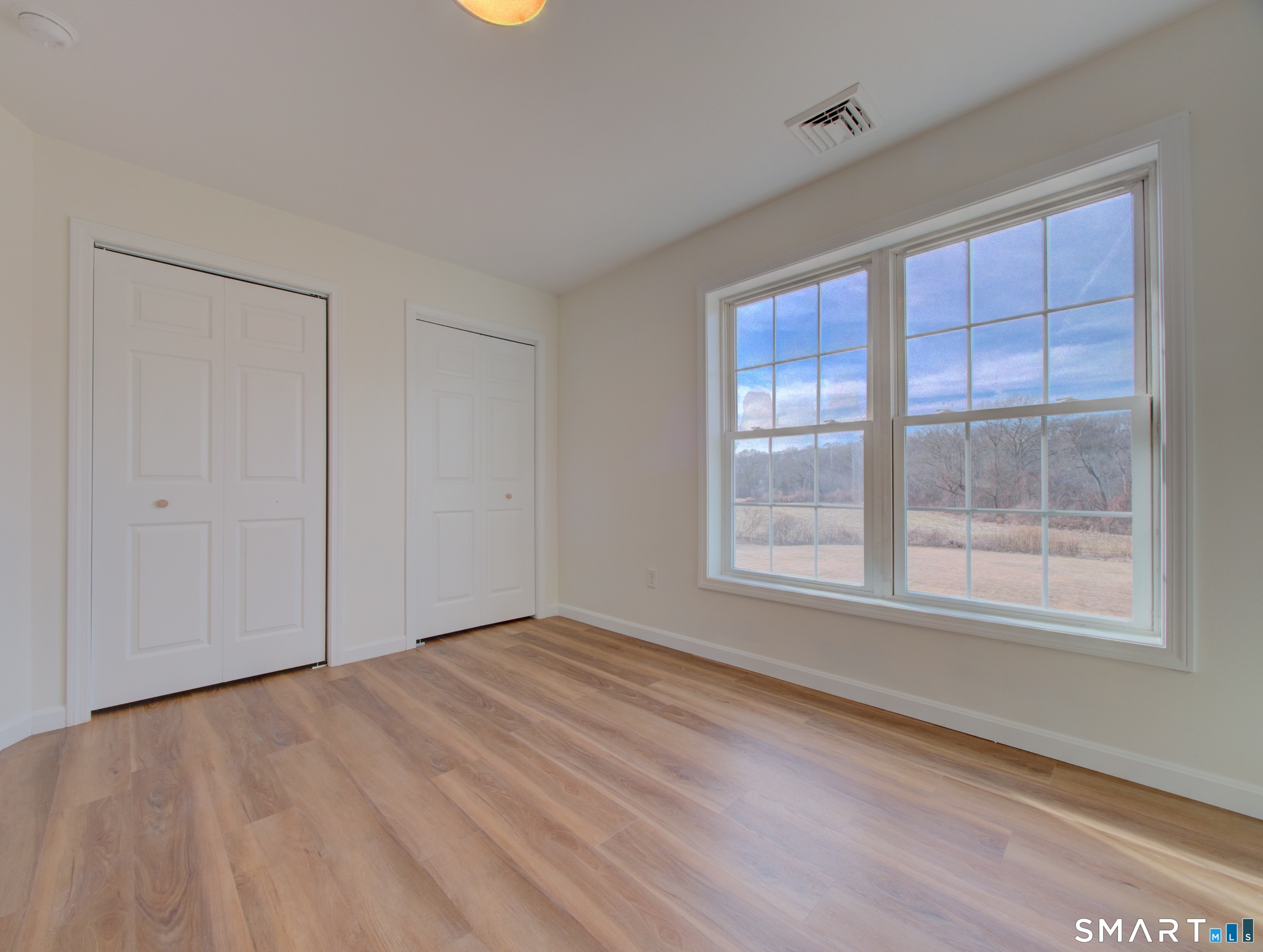 55 Tuckie Road Windham, CT 06280 - Photo 9 of 17 a view of an empty room with a window