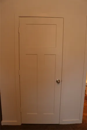 a view of kitchen with a refrigerator and a stove