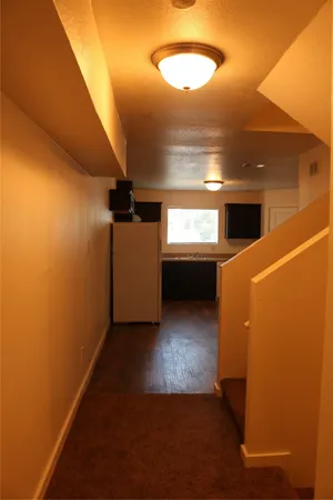 a view of a small space with wooden floor