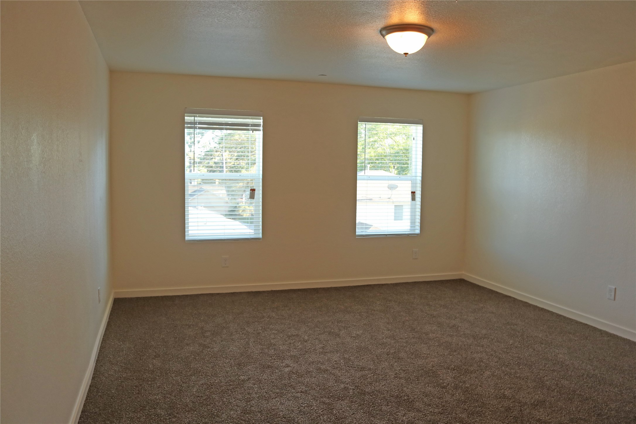 10535 Mills Road, Unit 9C Houston, TX 77070 - Photo 38 of 48 an empty room with windows
