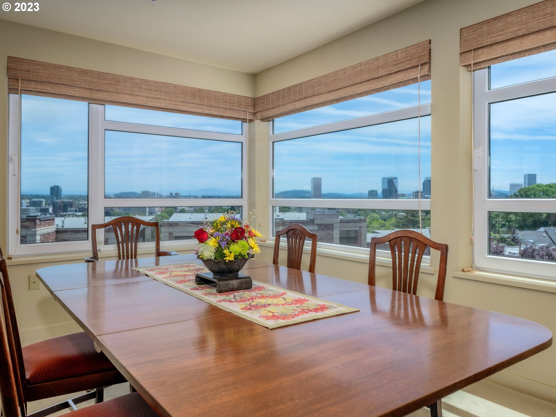 2445 Northwest Westover Road, Unit 411 Portland, OR 97210 - Photo 14 of 38 a dining room with furniture and wooden floor