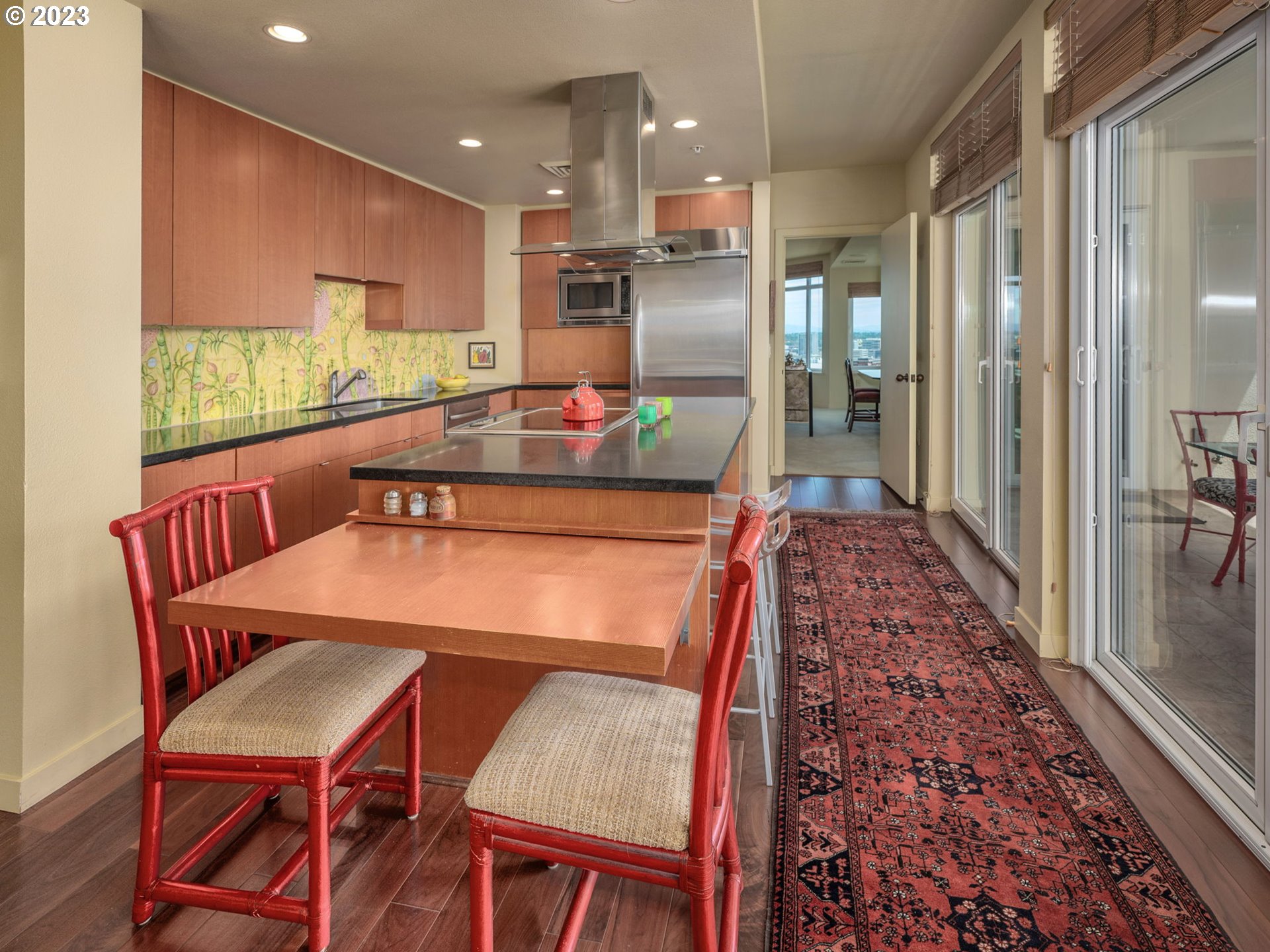 2445 Northwest Westover Road, Unit 411 Portland, OR 97210 - Photo 16 of 38 a dining room with furniture and a large window