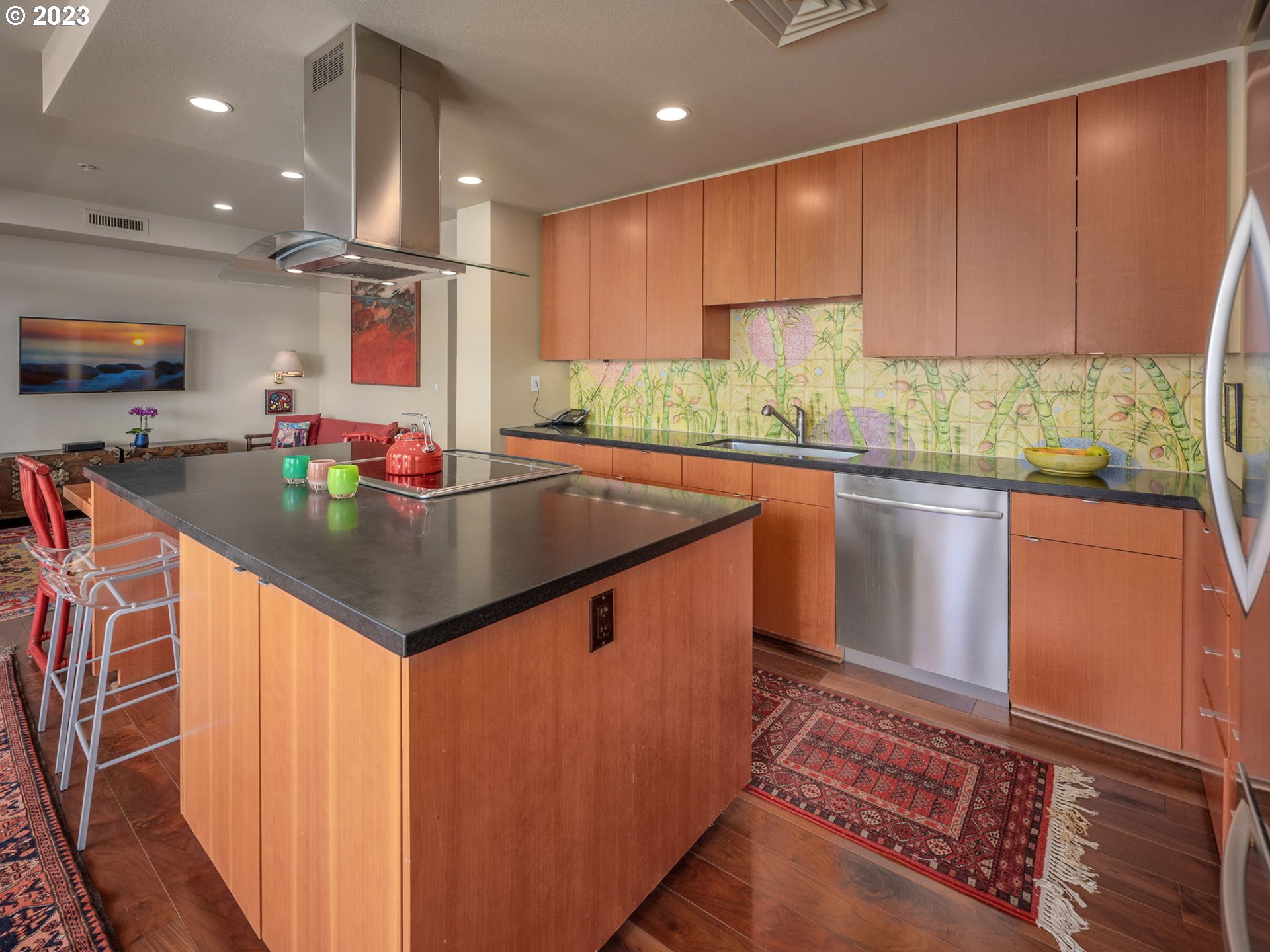 2445 Northwest Westover Road, Unit 411 Portland, OR 97210 - Photo 19 of 38 a kitchen with stainless steel appliances granite countertop a sink stove and cabinets