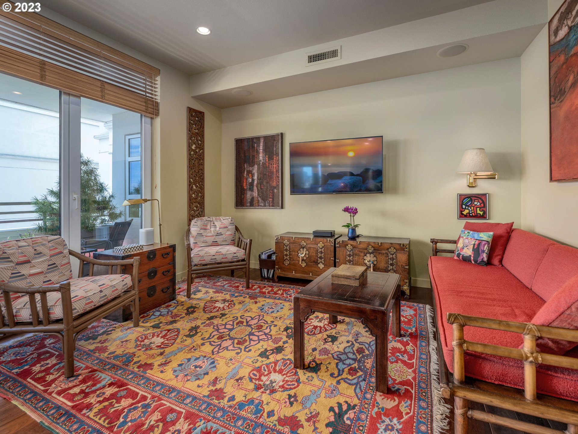 2445 Northwest Westover Road, Unit 411 Portland, OR 97210 - Photo 20 of 38 a living room with furniture and a flat screen tv