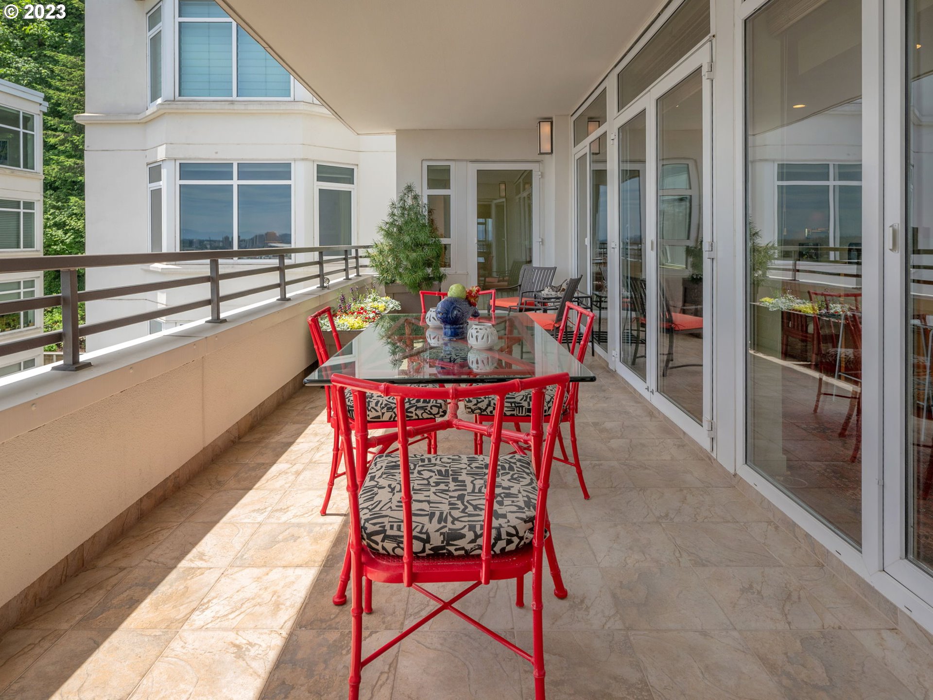 2445 Northwest Westover Road, Unit 411 Portland, OR 97210 - Photo 21 of 38 a balcony with furniture and wooden floor