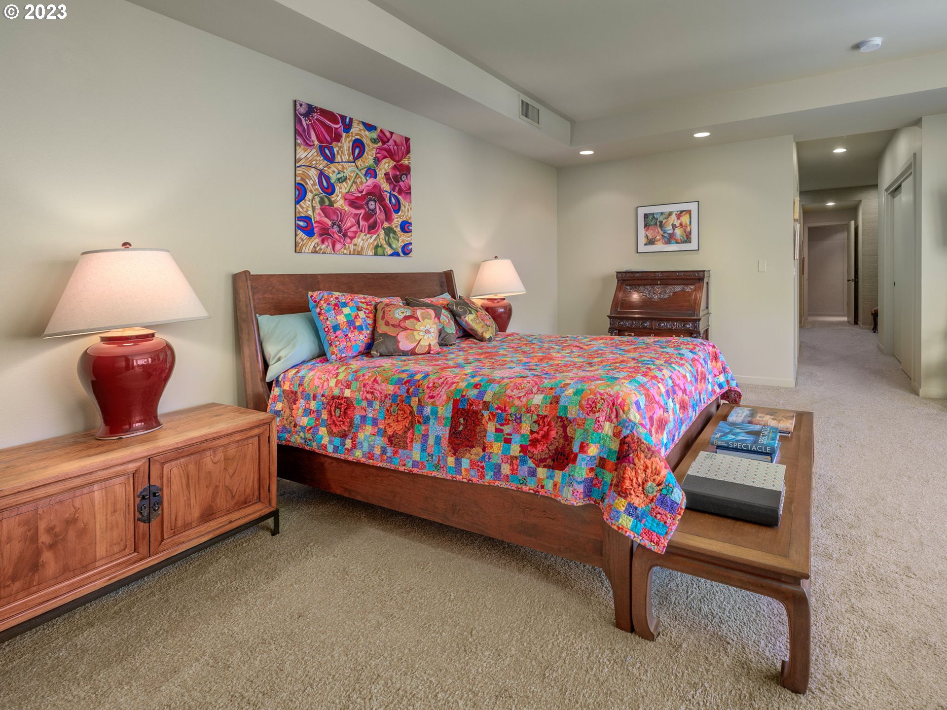 2445 Northwest Westover Road, Unit 411 Portland, OR 97210 - Photo 25 of 38 a bedroom with a bed and a lamp