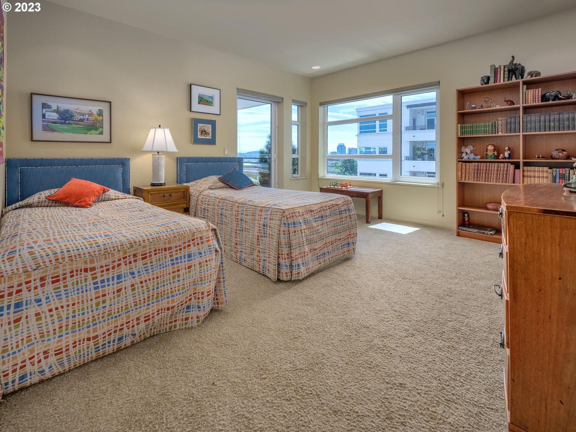 2445 Northwest Westover Road, Unit 411 Portland, OR 97210 - Photo 29 of 38 a bedroom with bed and window
