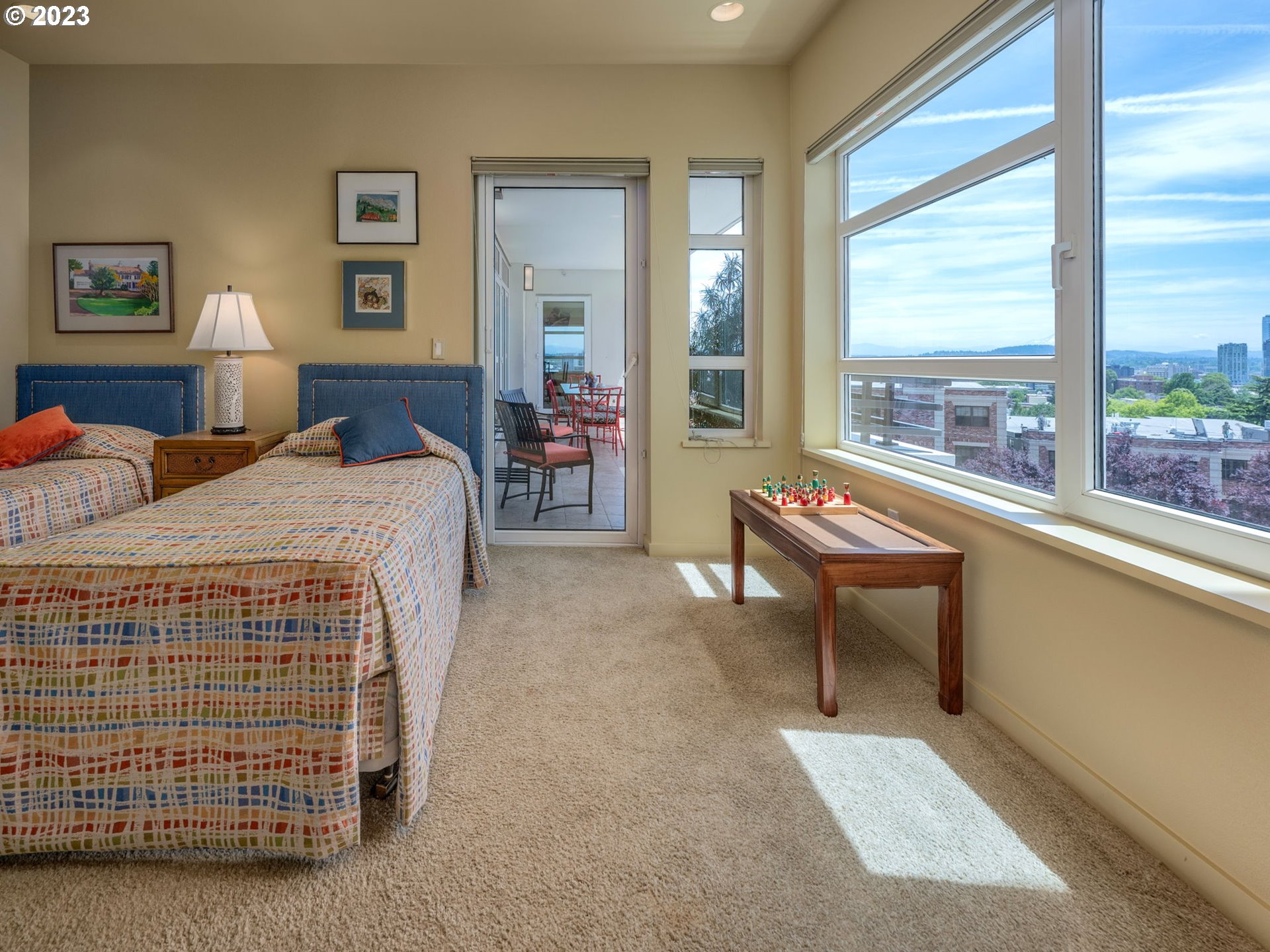 2445 Northwest Westover Road, Unit 411 Portland, OR 97210 - Photo 30 of 38 a bedroom with bed and a large window