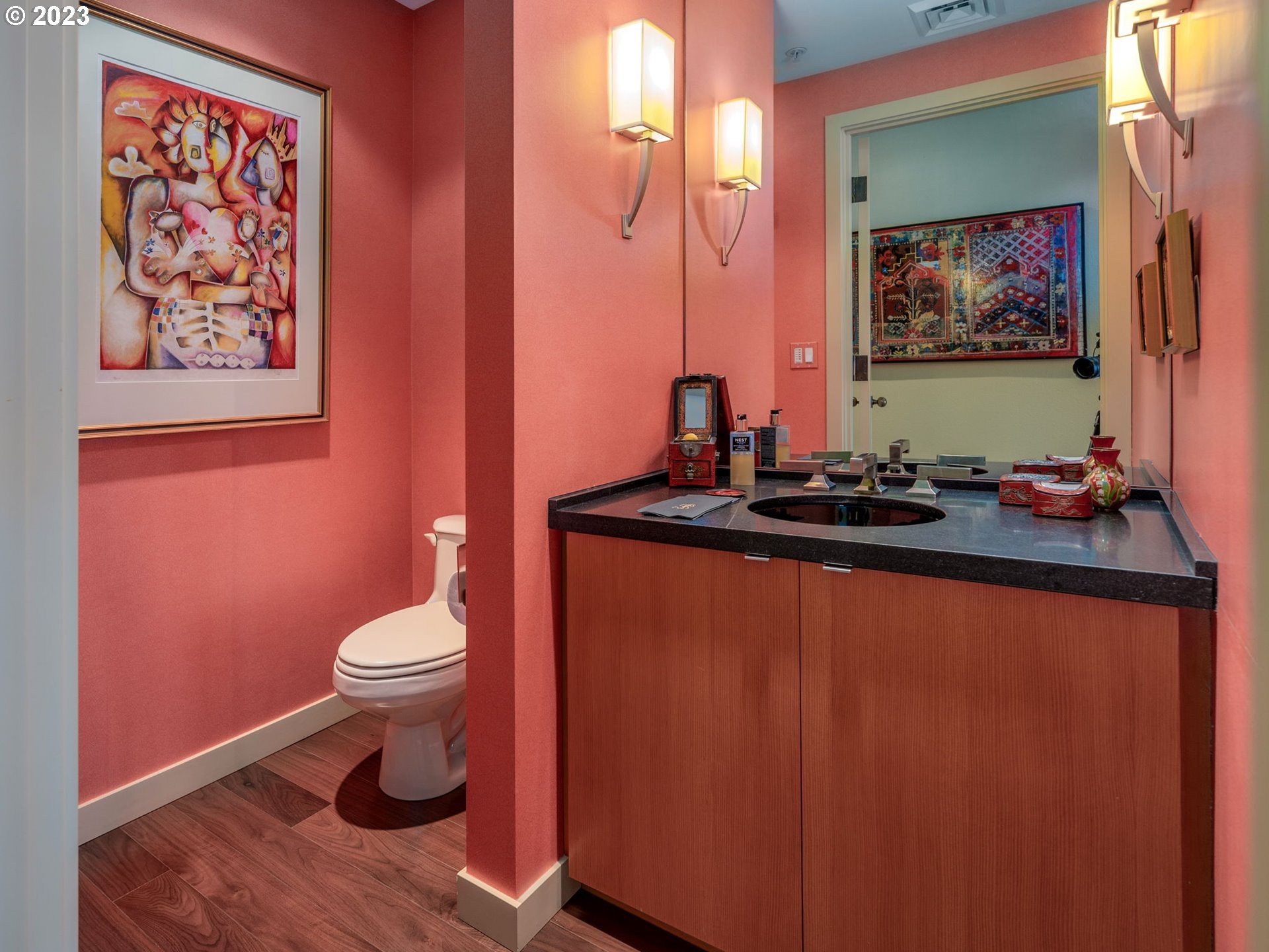 2445 Northwest Westover Road, Unit 411 Portland, OR 97210 - Photo 33 of 38 a bathroom with a sink and a mirror