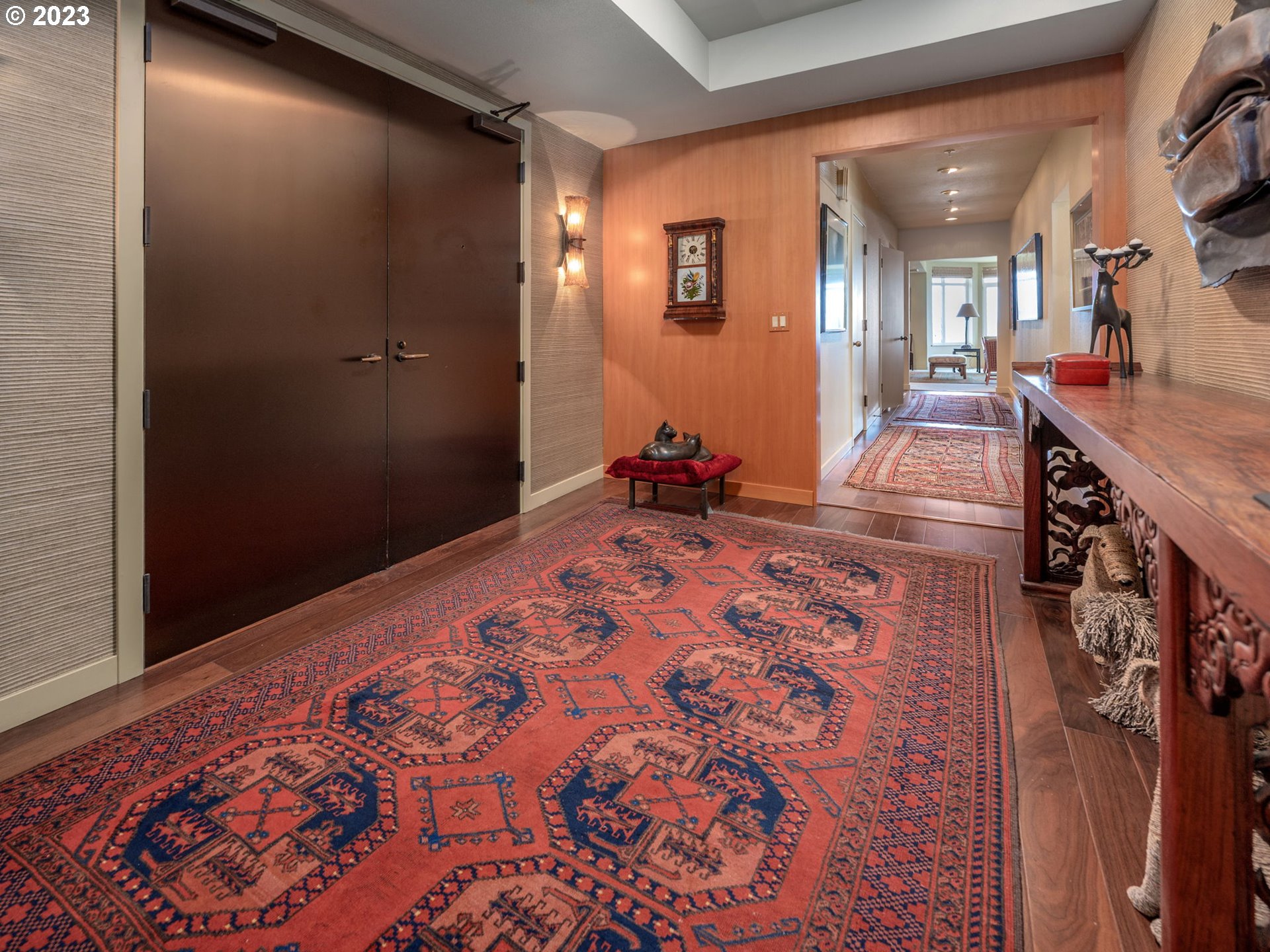2445 Northwest Westover Road, Unit 411 Portland, OR 97210 - Photo 4 of 38 a bedroom with a bed and a mirror
