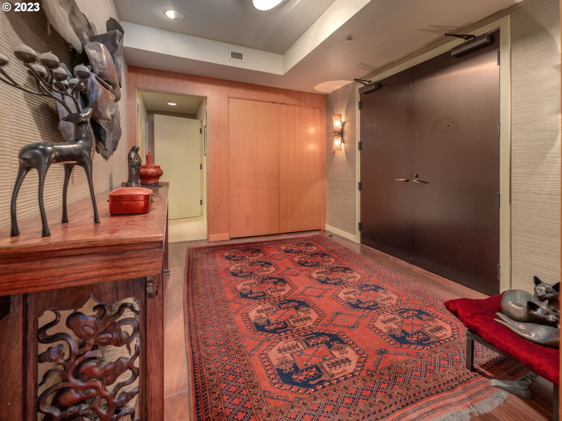 2445 Northwest Westover Road, Unit 411 Portland, OR 97210 - Photo 5 of 38 a bedroom with a bed and a dresser