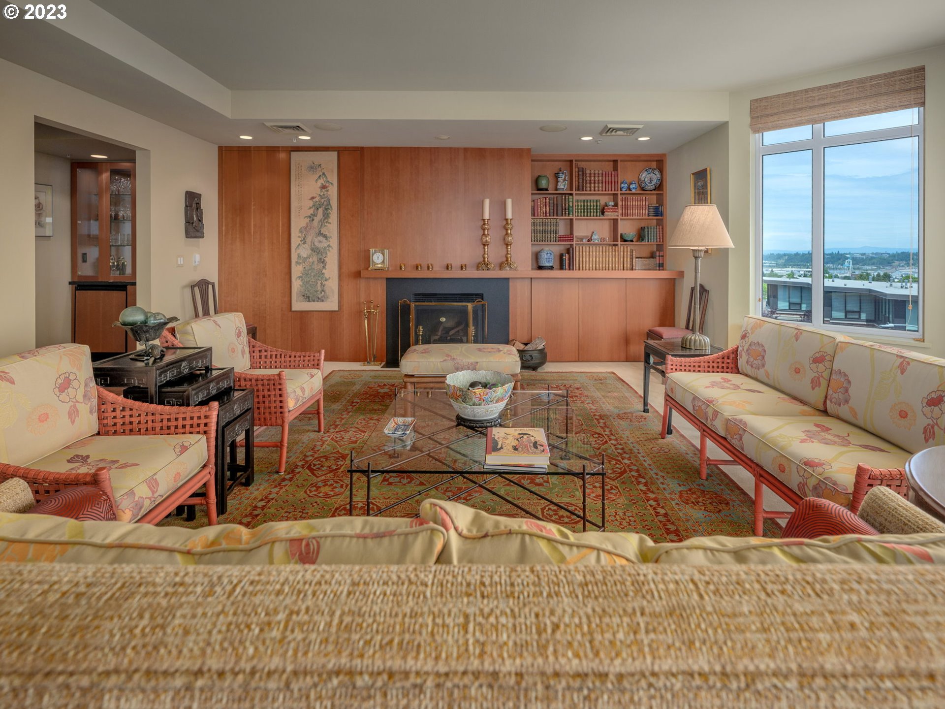 2445 Northwest Westover Road, Unit 411 Portland, OR 97210 - Photo 6 of 38 a living room with furniture window and a fireplace