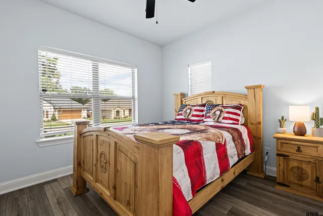 a bedroom with bed and a window