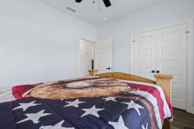 a bedroom with a bed and a cabinets