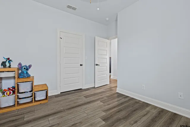 a hallway with wooden floor