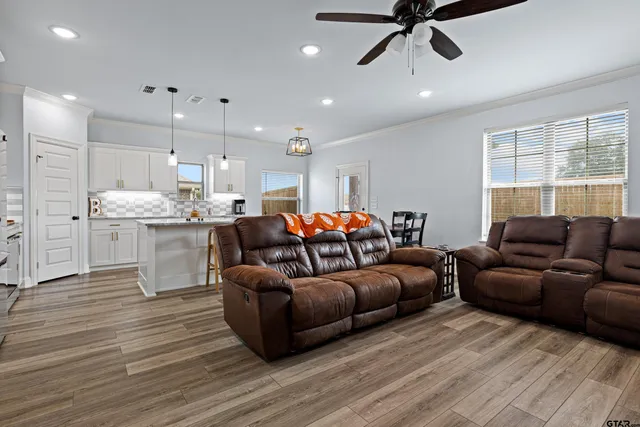 a living room with furniture and a large window