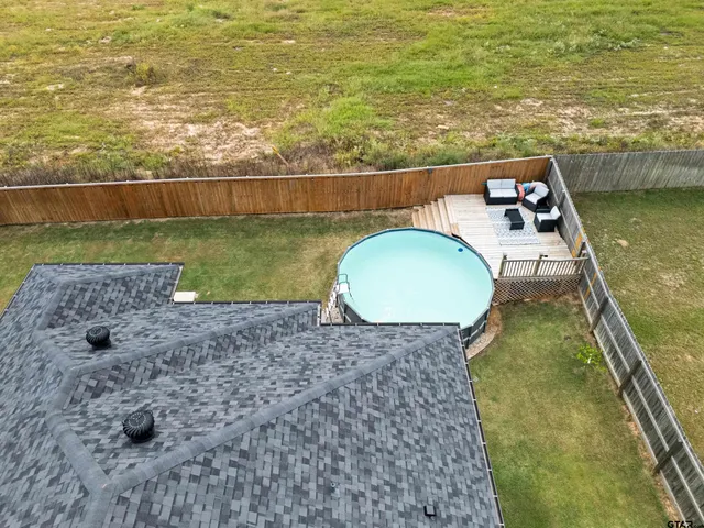 a aerial view of a house with garden