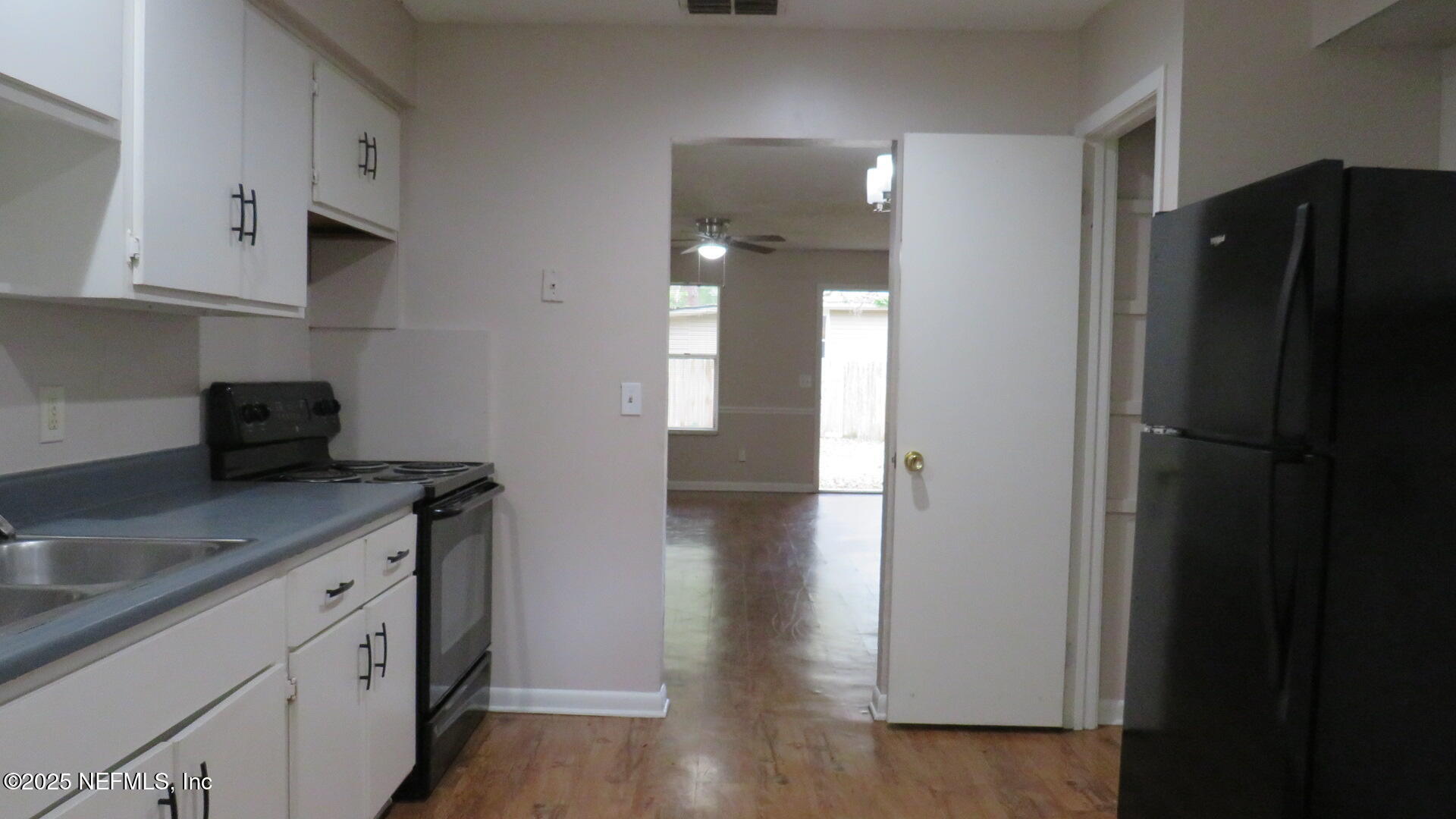 1160 Mohawk Street, Unit 2 Jacksonville, FL 32205 - Photo 7 of 9 a kitchen with stainless steel appliances granite countertop a refrigerator and a sink