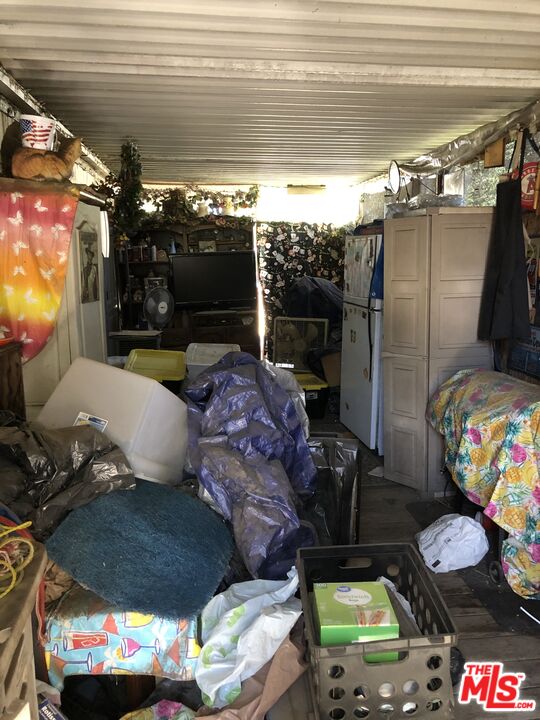 32886 Wildomar Trail Wildomar, CA 92595 - Photo 19 of 22 a living room with furniture and a flat screen tv
