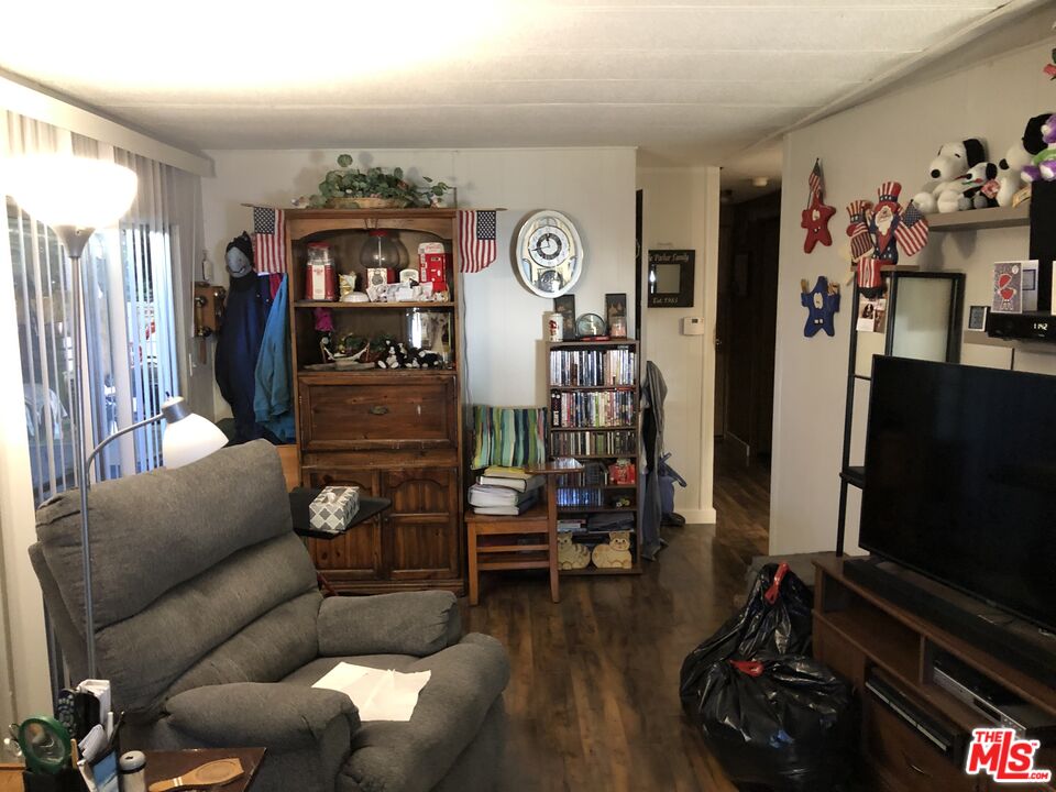 32886 Wildomar Trail Wildomar, CA 92595 - Photo 2 of 22 a living room with furniture and wooden floor