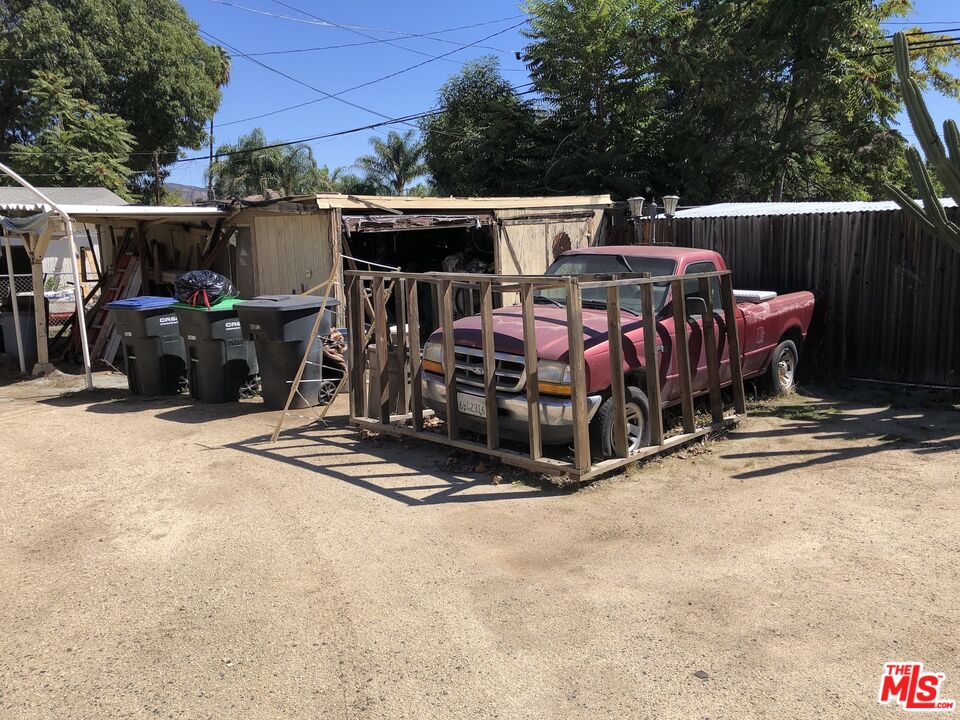 32886 Wildomar Trail Wildomar, CA 92595 - Photo 22 of 22 a view of a patio with table and chairs