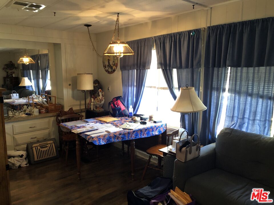 32886 Wildomar Trail Wildomar, CA 92595 - Photo 3 of 22 a view of a dining room with furniture and chandelier